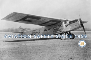 Small aircraft flying above clouds as aviation safety has evolved since Buddy Holly's era.