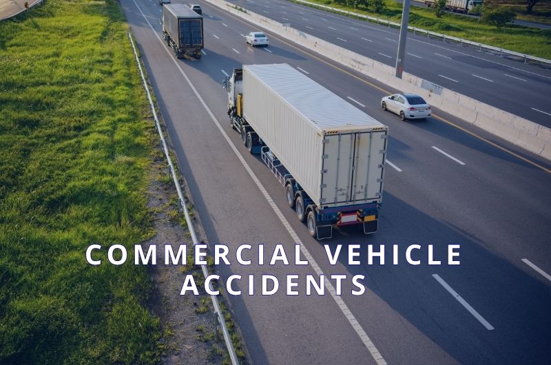 Commercial vehicles traveling on a roadway in West Texas.