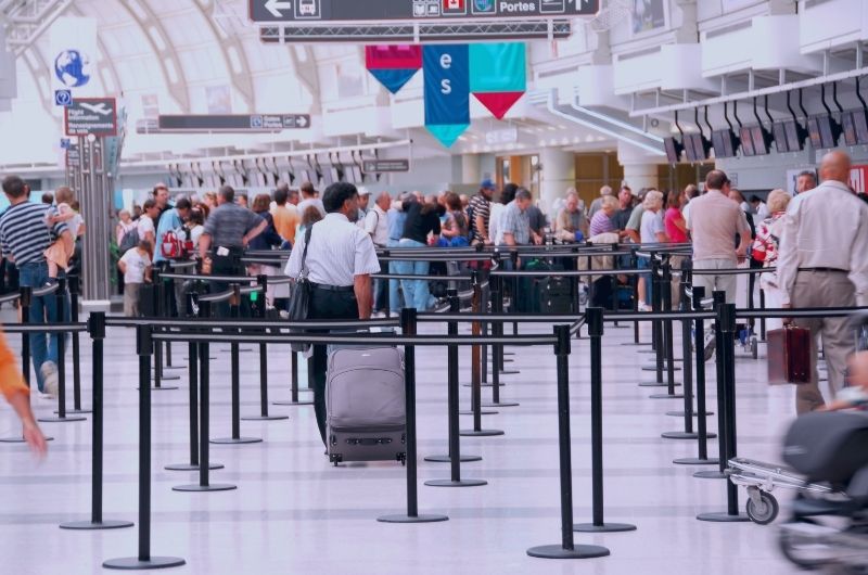 Traveler walking through Austin-Bergstrom International Airport where airport injury accidents may occur.