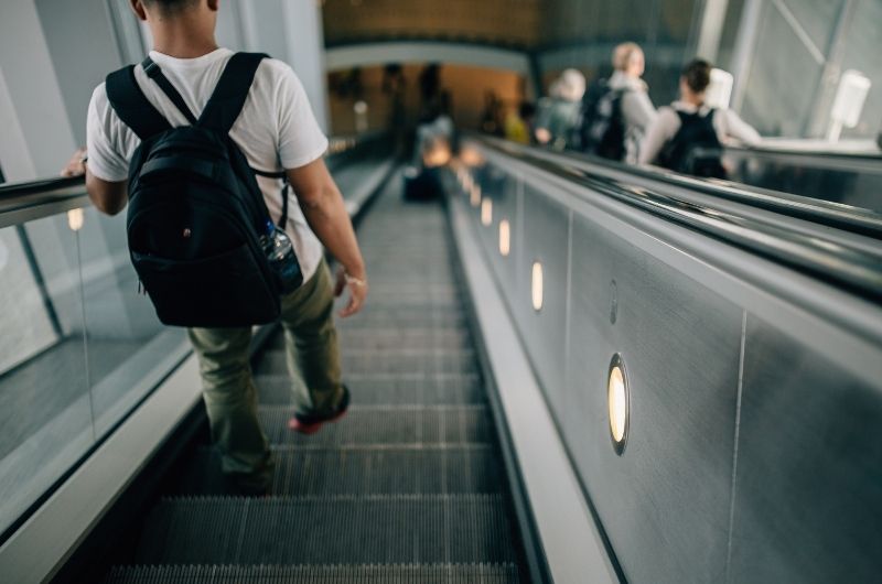 Traveler walking through Austin-Bergstrom International Airport where airport injury accidents may occur.