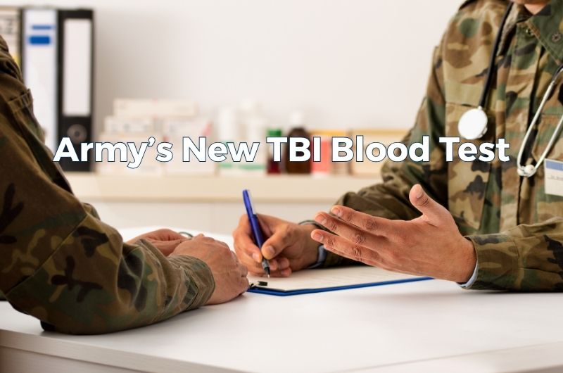 Military medic using a handheld device to evaluate a service member for a suspected traumatic brain injury.