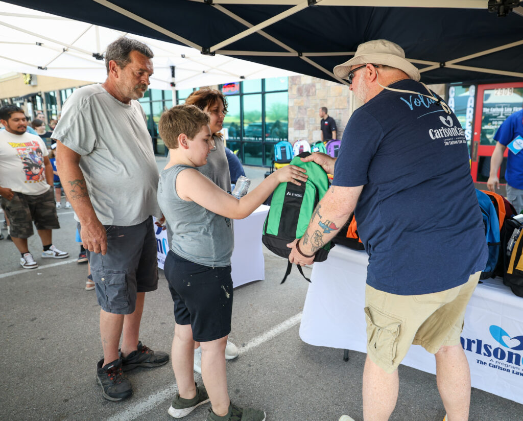 Carlson Cares welcomed more than 400 community members while distributing 250 backpacks to Wichita Falls students before the new school year.