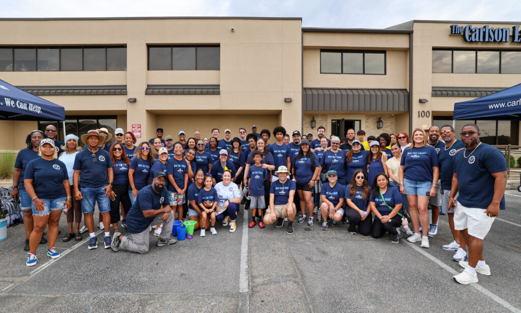 Group photo of volunteers for Carlson Cares Killeen Backpack Giveaway