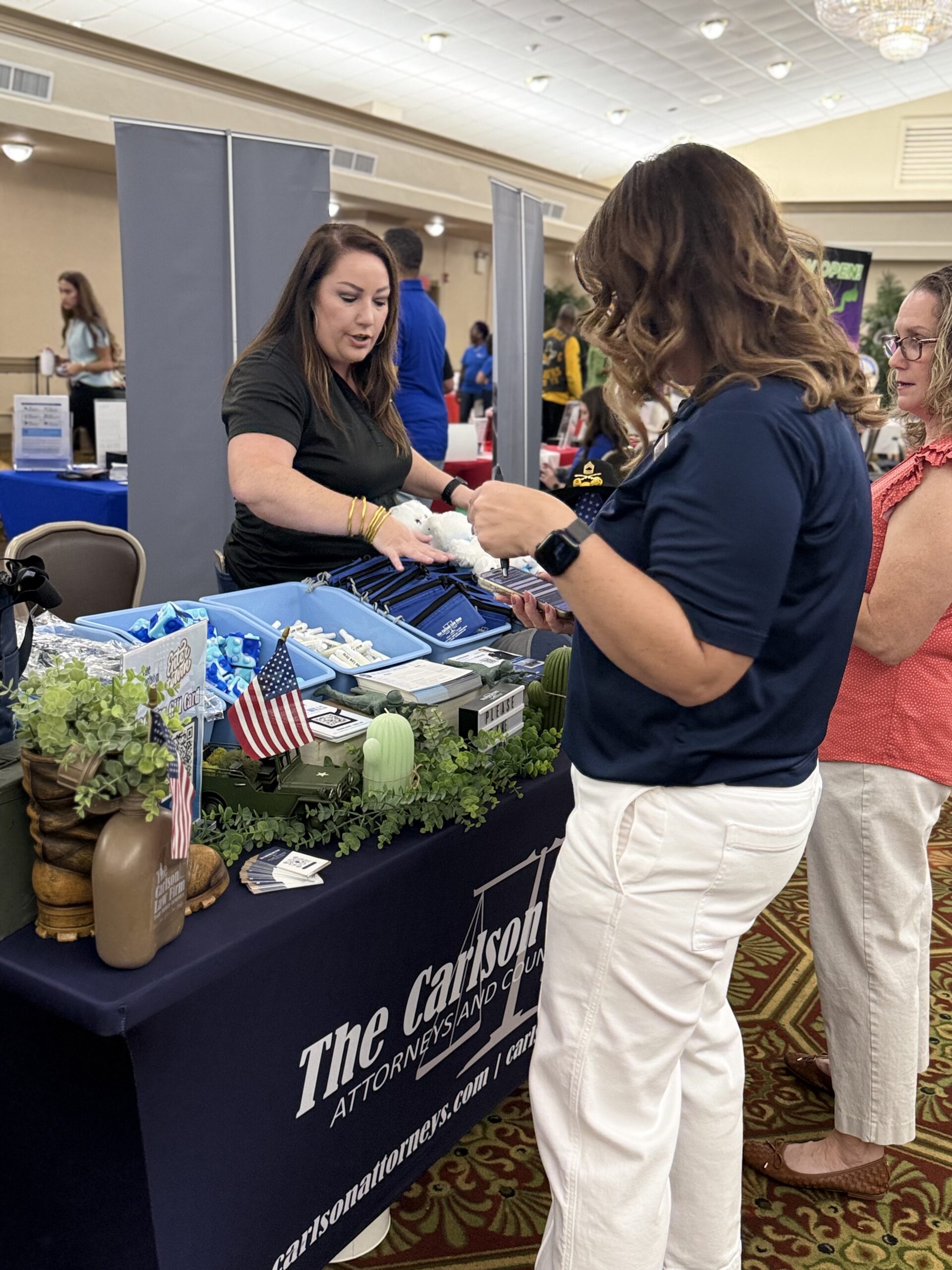The Carlson Law Firm meets with attendees at Hood Howdy 2026.