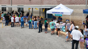 CarlsonCares hosts a backpack giveaway for families at Casey Elementary in South Austin.