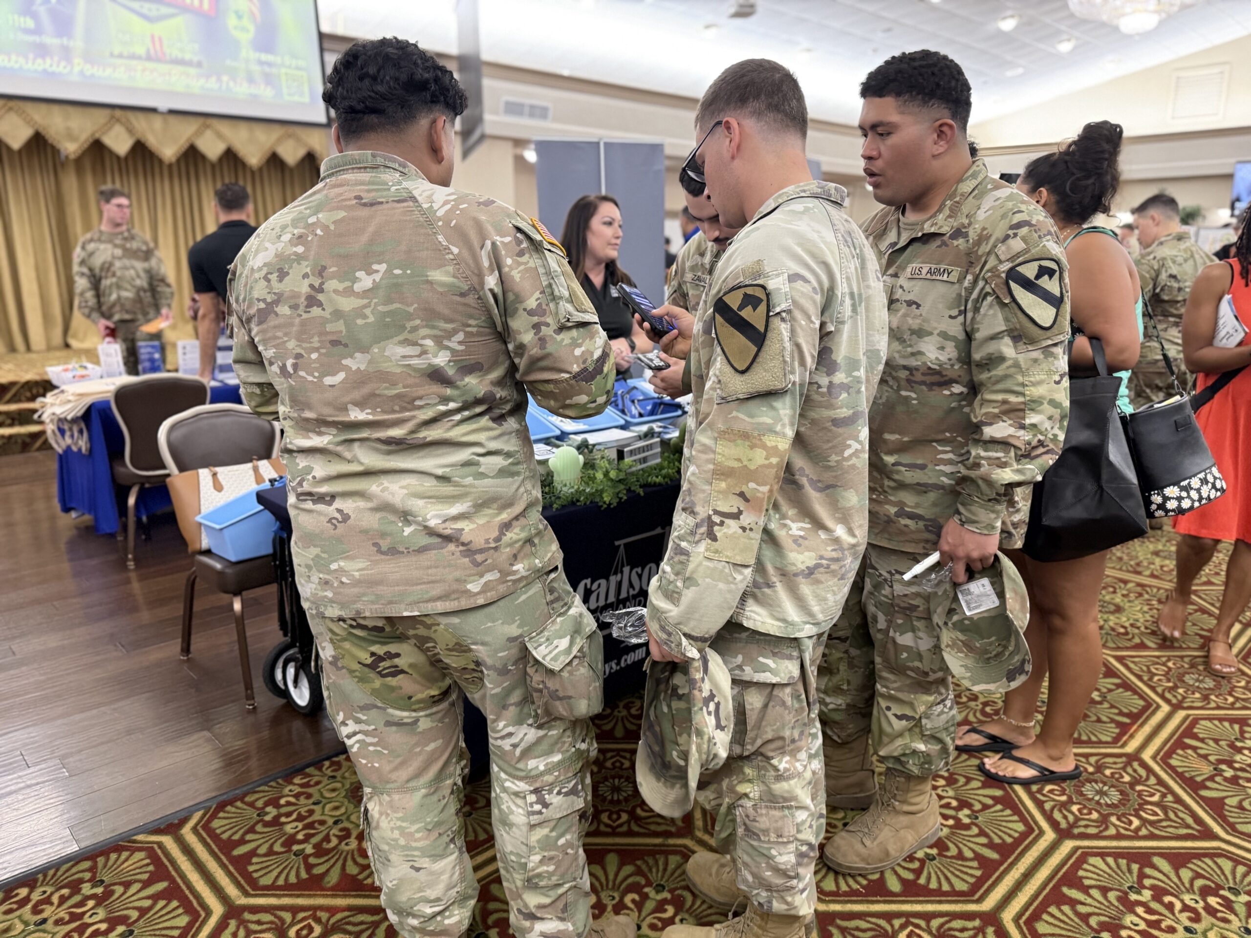 Fort Hood soldiers visit The Carlson Law Firm table during Hood Howdy 2026.