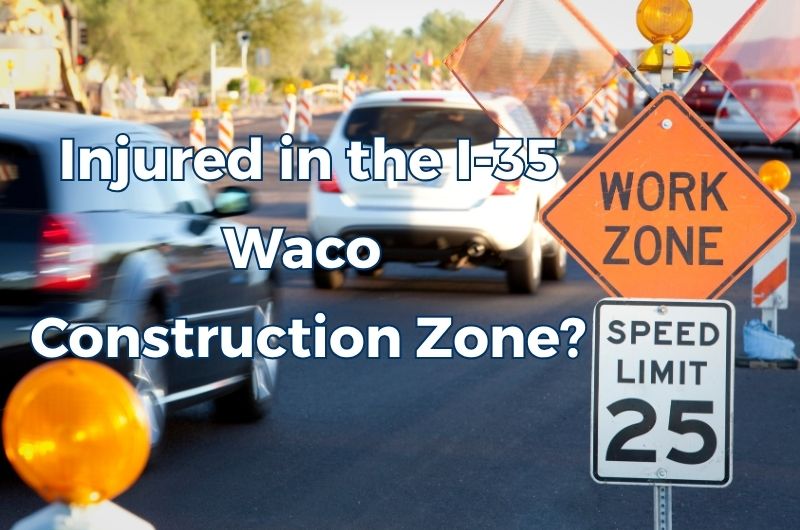 Traffic traveling through an Interstate 35 construction zone in Waco, Texas, with a work zone sign in the foreground.