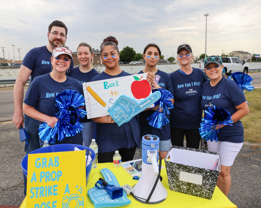 Carlson Cares volunteers helping students get excited for school year.