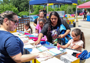 Students select free school supplies during the Carlson Cares San Marcos Backpack Giveaway.