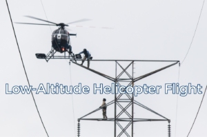 Helicopter operating at low altitude near power lines.