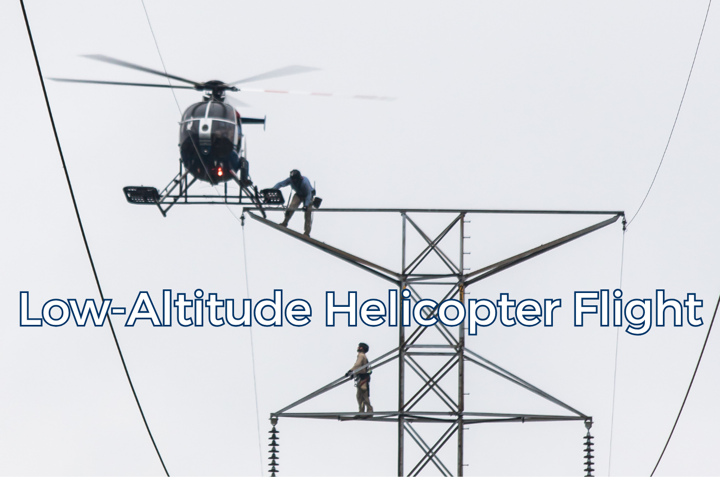Helicopter operating at low altitude near power lines.