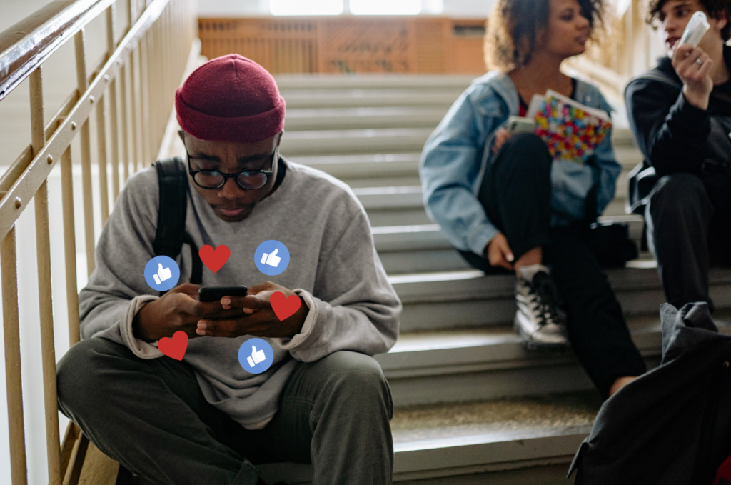 Teen using a smartphone with social media reaction icons.