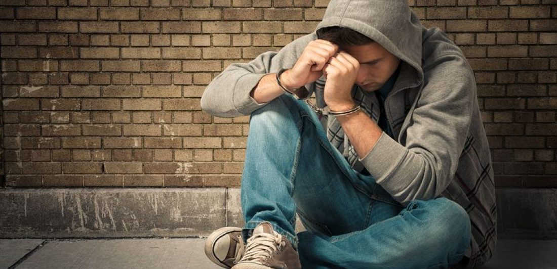 15134556 – arrested teenager with handcuffs on his hands Image of a sad man in handcuffs