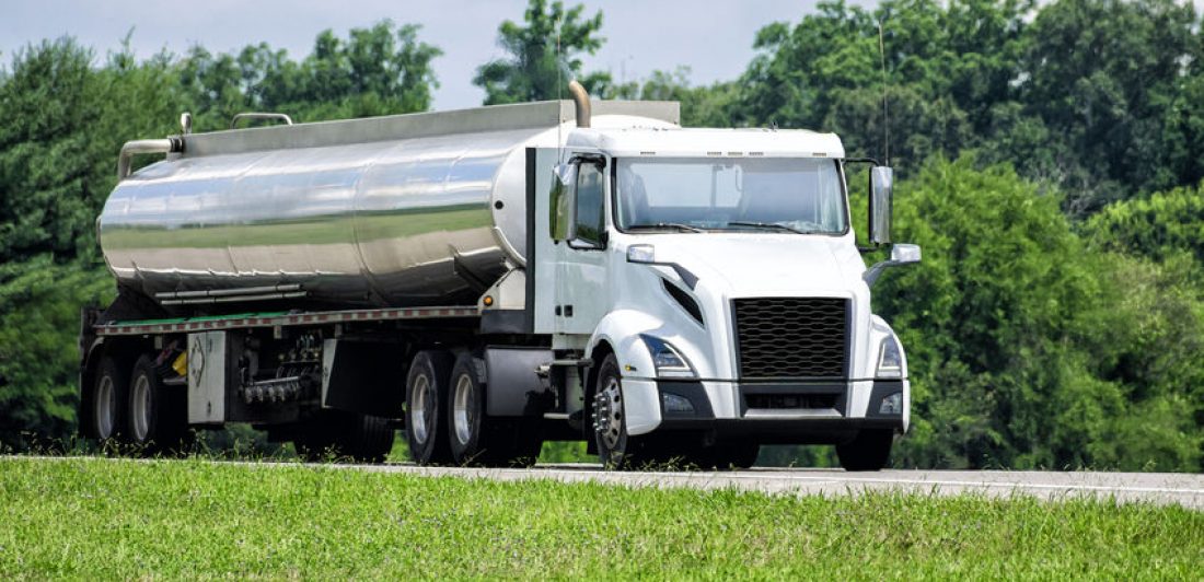 Unmarked Gasoline Delivery Tanker Truck On The Highway Image of a tanker truck on the highway