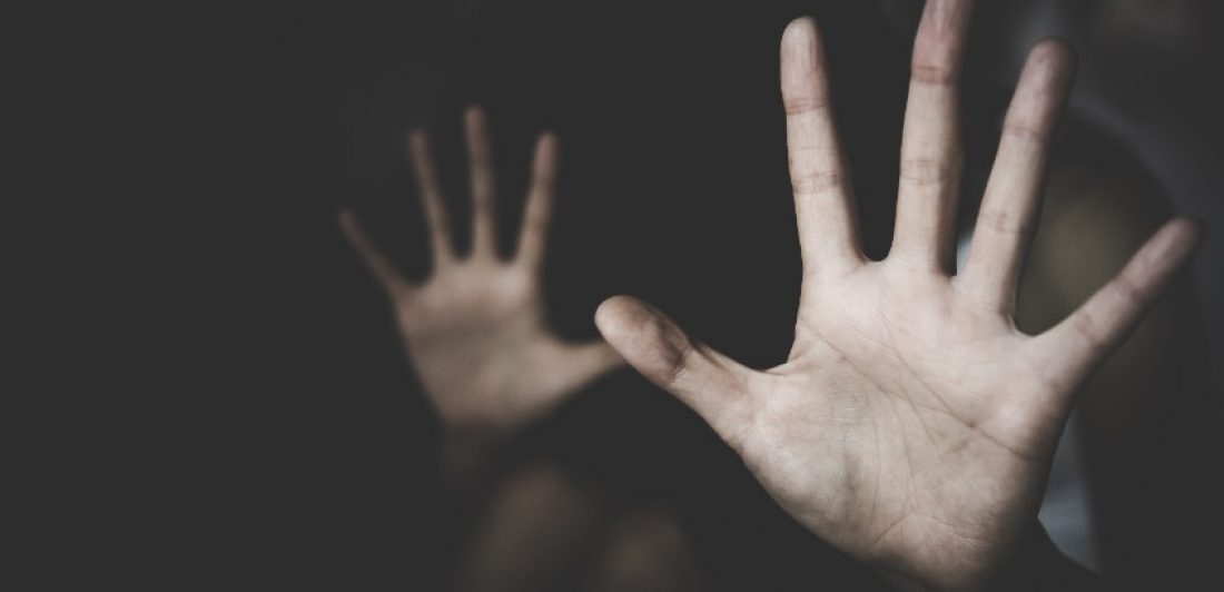 156887579_s Image of two hands held up in the dark