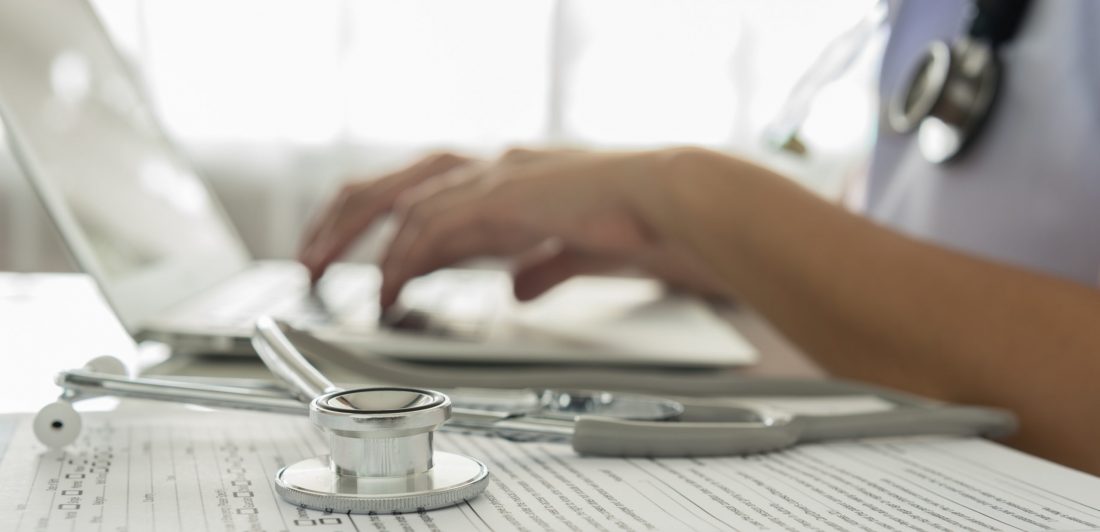 doctor working Image of healthcare worker typing on laptop with stethoscope