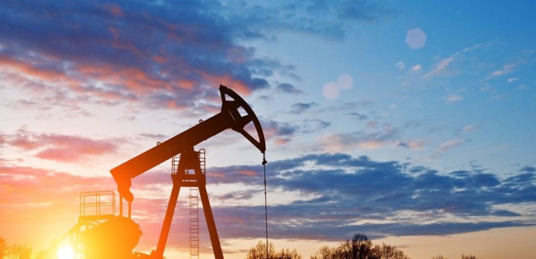 Image of oil rig at sunset