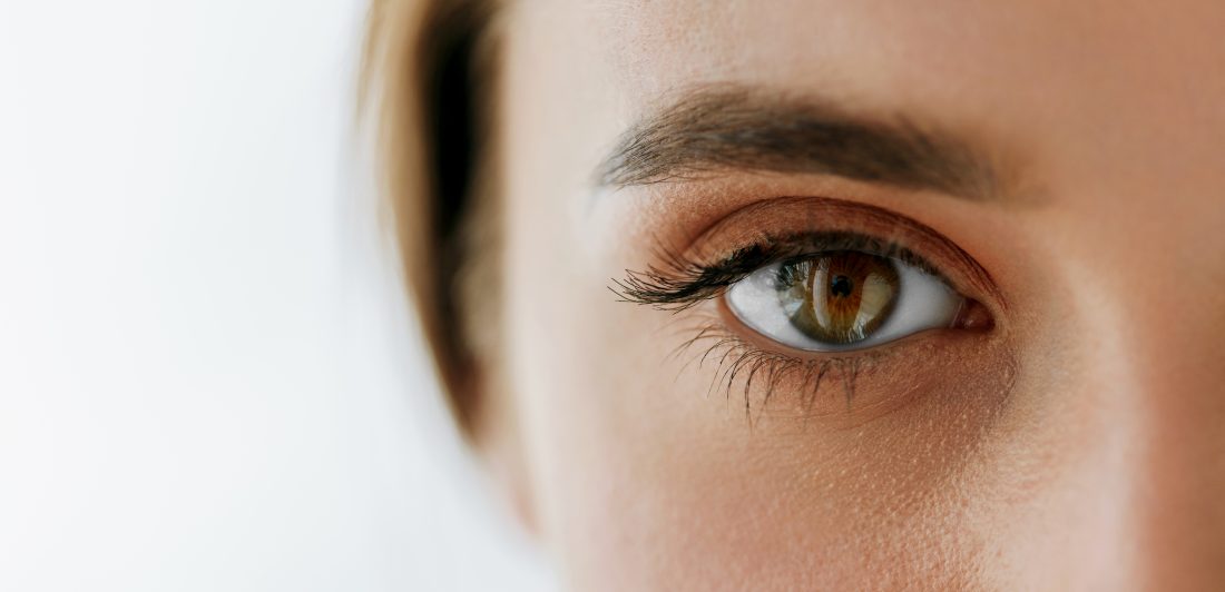 Closeup Of Beautiful Girl Eye And Eyebrow With Natural Makeup Close up image of a woman's eye