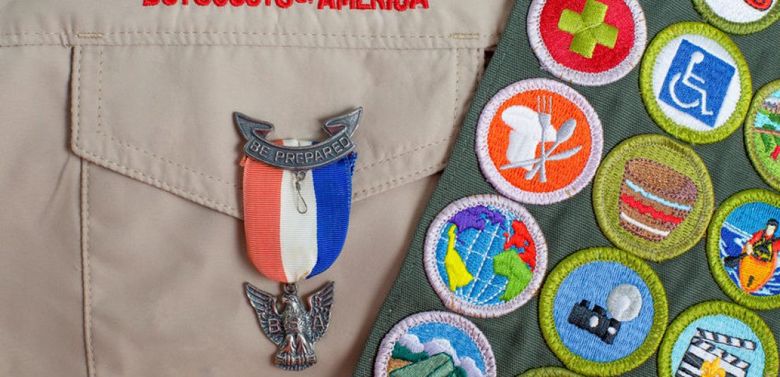 Eagle pin and merit badge sash on boy scout uniform Image of boyscout regalia