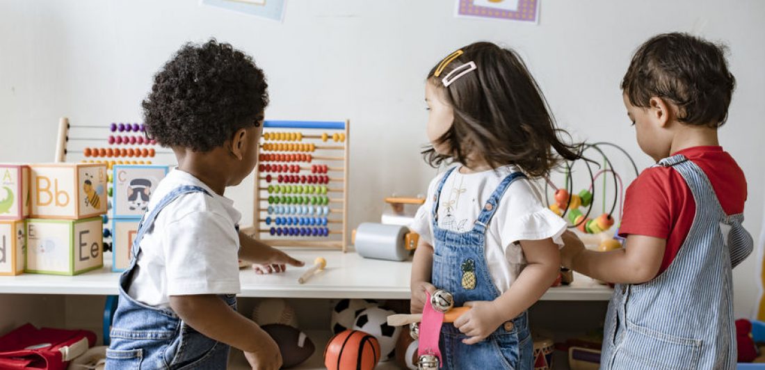 Young children playing with educational toys Image of preschoolers playing with toys in a classroom