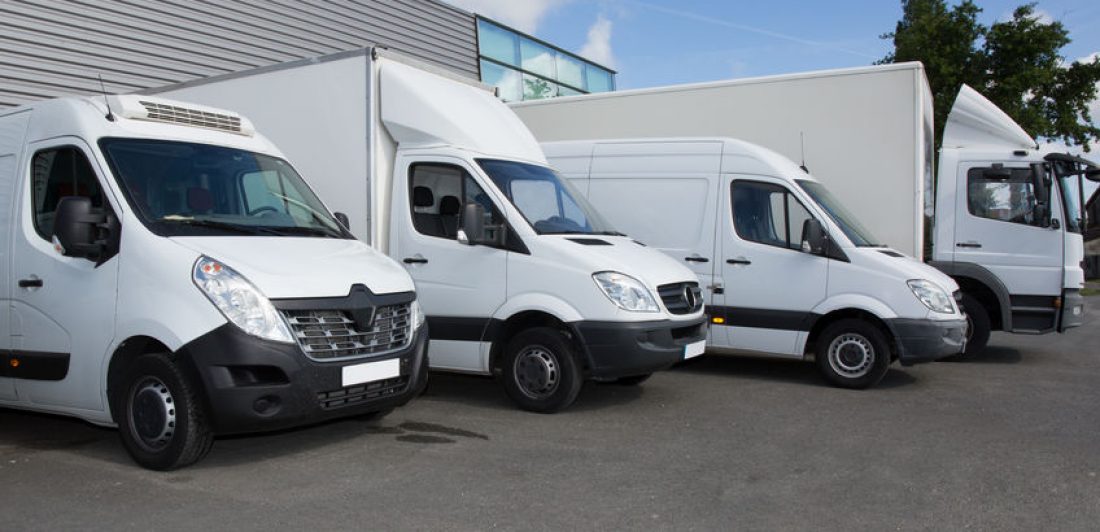 Several cars vans and trucks parked in parking lot for sale Image of moving vans and trucks parked in a lot