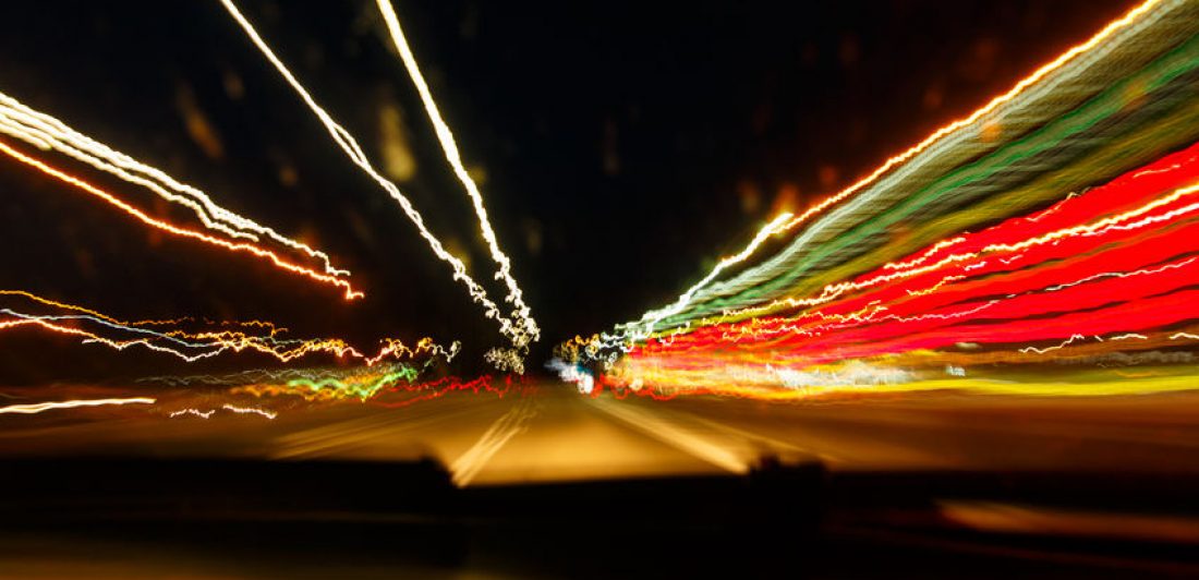 Drugged-driving Image with our of focus lights on a street at night