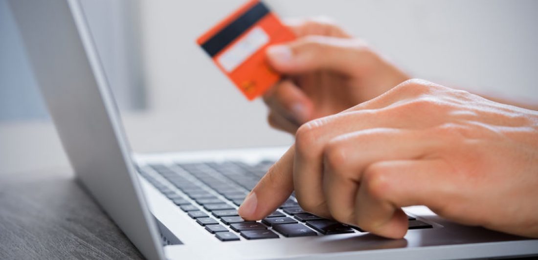 Online payment Image of person making an online payment on their laptop