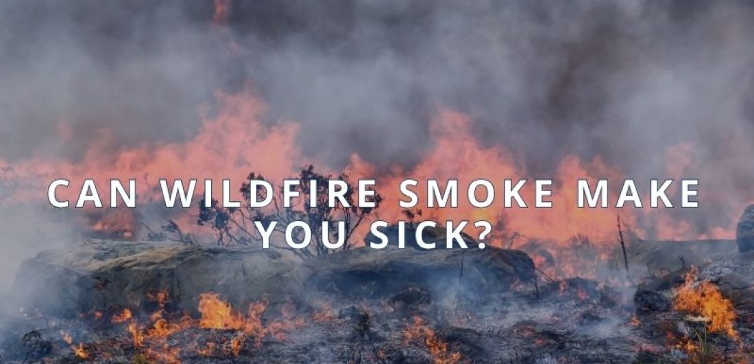 Wildfire smoke creating hazy air conditions over a community.