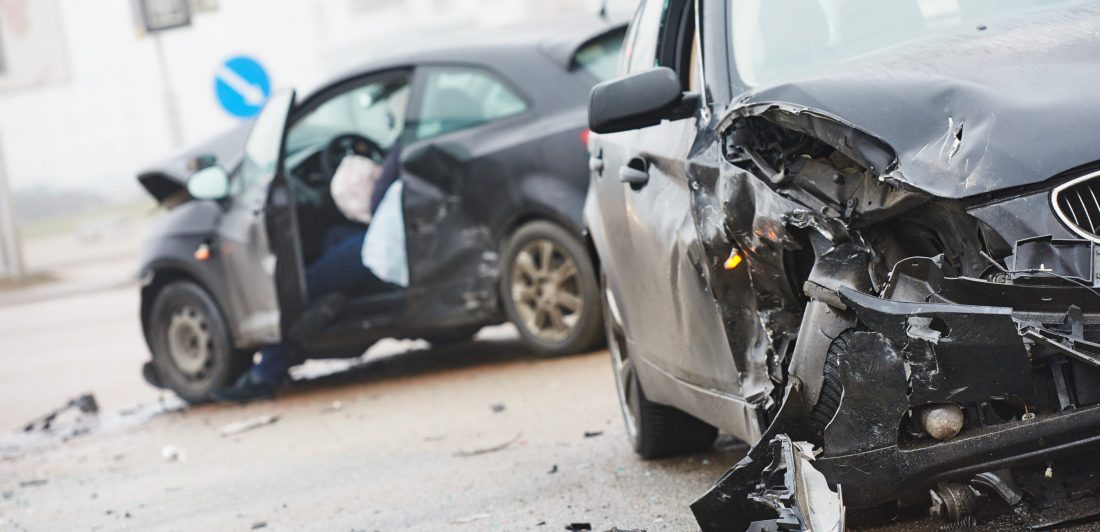 car crash collision in urban street Image of a two car collision
