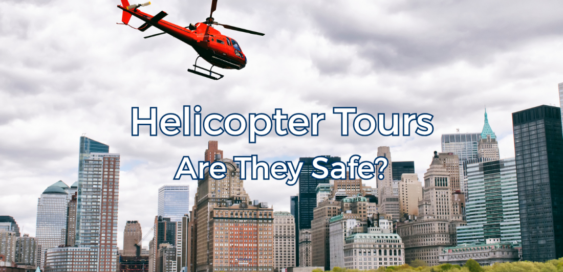 Red helicopter flying above a city skyline.