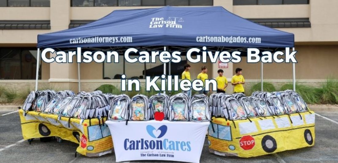 Children and families receive backpacks and school supplies during the 2026 Carlson Cares Killeen Backpack Giveaway.