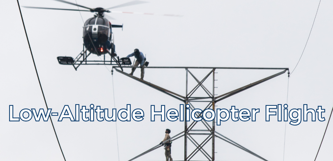 Helicopter operating at low altitude near power lines.