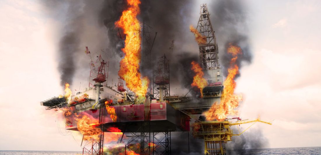 Image of an offshore oil rig on fire