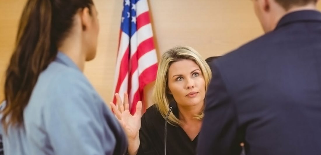 post-child-support-cap-increase Graphic of a man and woman speaking to a judge in front of an american flag