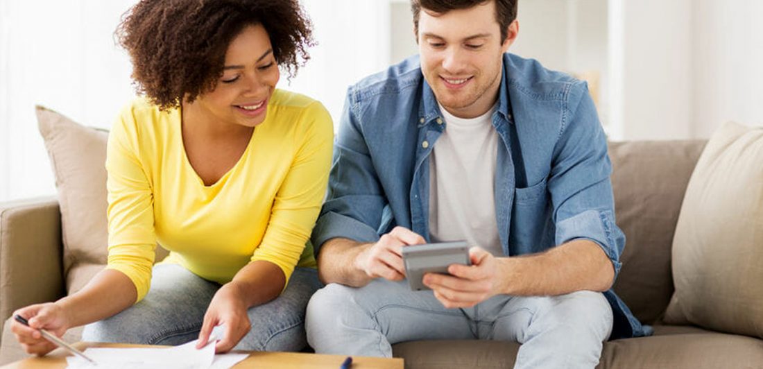 Image of a couple working on a budget