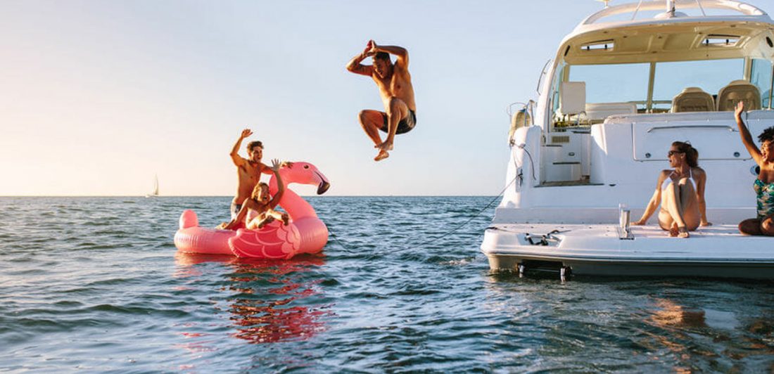 post-fourth-of-july-boat-party Image of people having fun on a boat and in the water