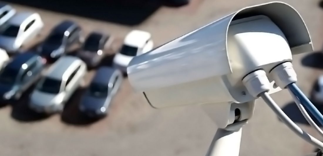 post-inadequate-safety-lawsuit-texas Image of security camera overlooking parking lot filled with cars