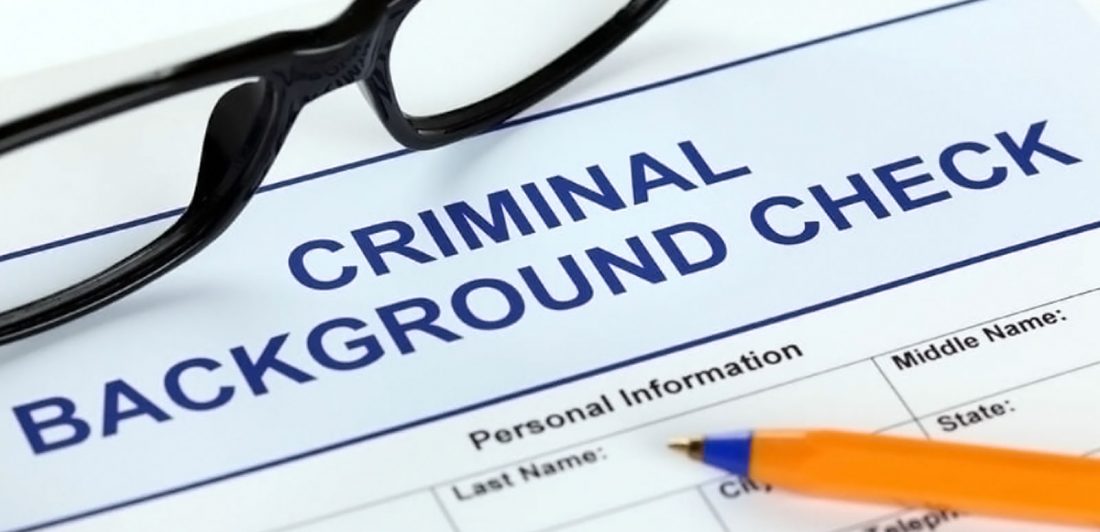 post-job-hunting-with-criminal-record Image of criminal background check form, pen, and eyeglasses
