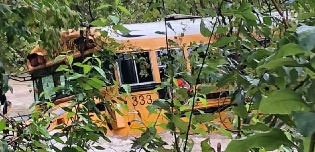 post-leander-isd-bus-swept-away Image of LISD bus being carried away by fast moving water