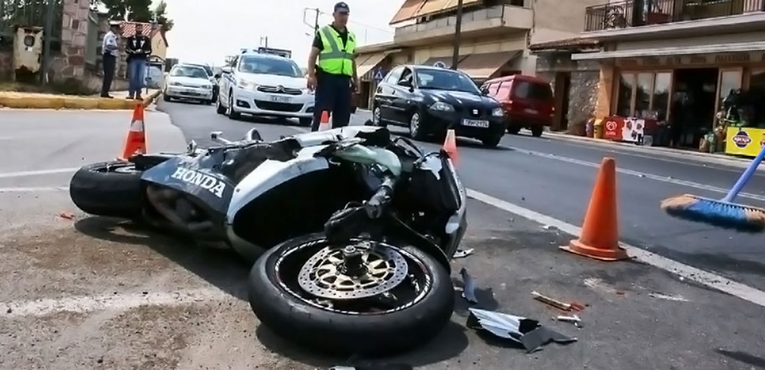 post-motorcycle-crash-attorney Image of motorcycle accident on a busy city street with public safety workers standing by