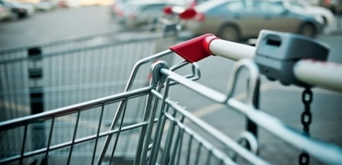 post-parking-lot-safety Image of shopping cart in a parking lot full of cars