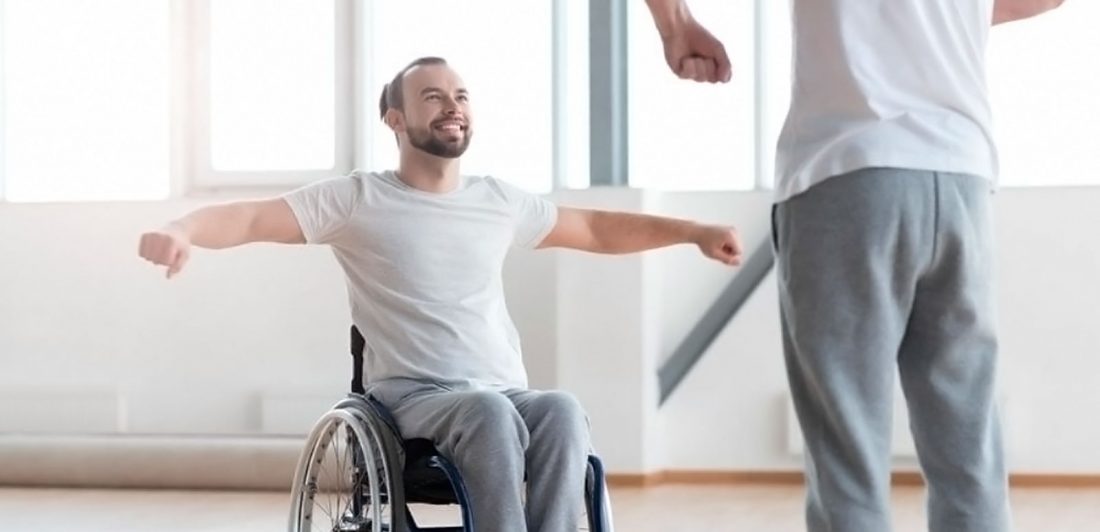 post-spinal-cord-injury Image of man in a wheelchair performing physical therapy motions