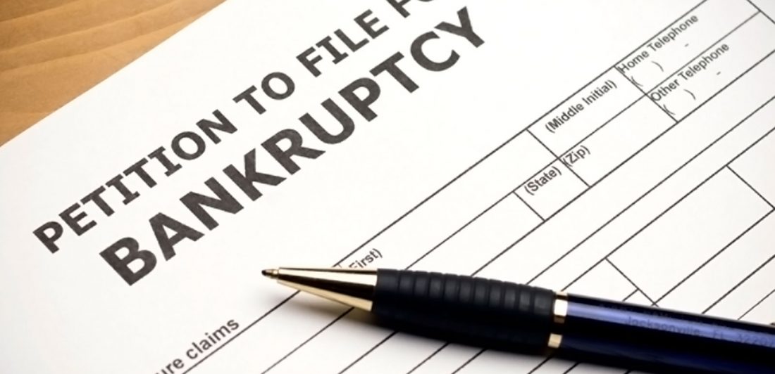 post-successful-bankruptcy-guide Image of petition to file for bankruptcy document with a blue pen