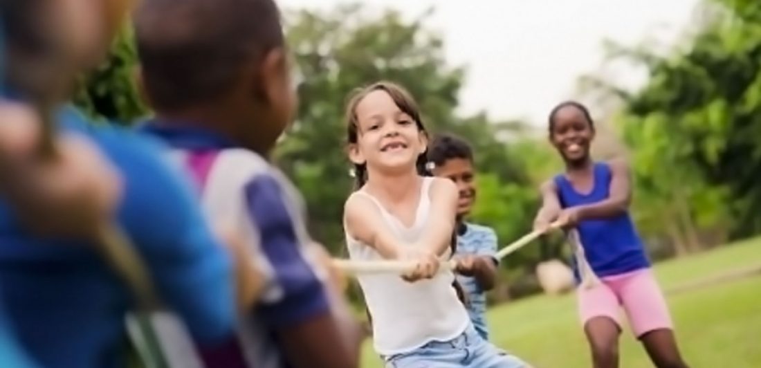 post-summer-camp-injuries Image of children playing tug of war