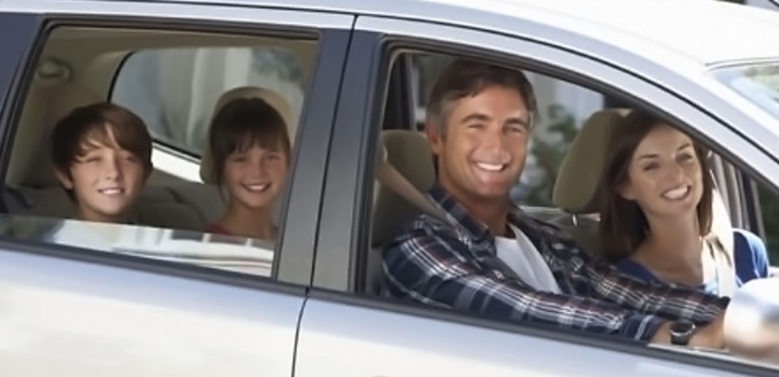 post-thanksgiving-travel-tips Image of happy family inside a vehicle