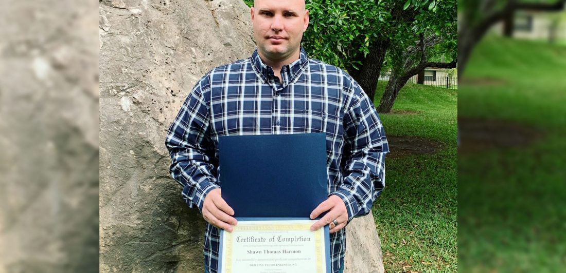 Image of man with certificate of completion for drilling fluids engineering