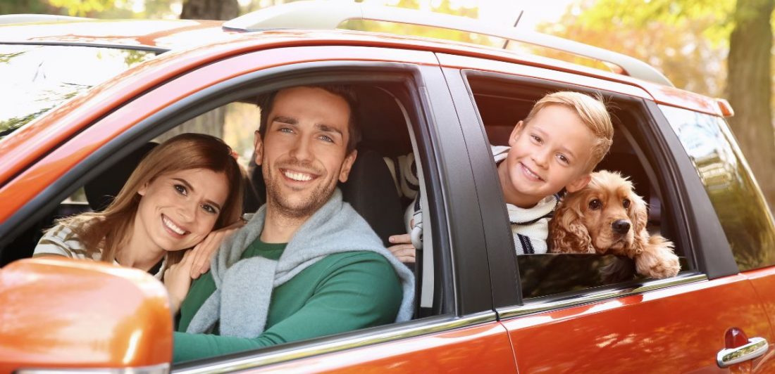 Family smiling because of safe tips for Thanksgiving travel