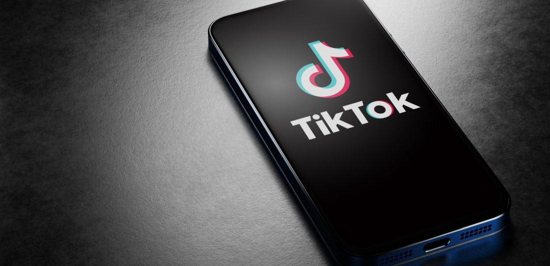tiktok-screen-time-scaled Image of cell phone with Tiktok logo displayed