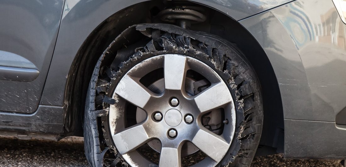 tire-failure Image of car with a flat tire