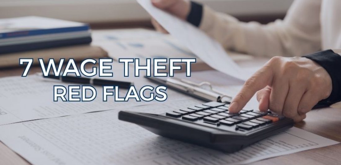 Calculator and financial records representing common wage theft red flags